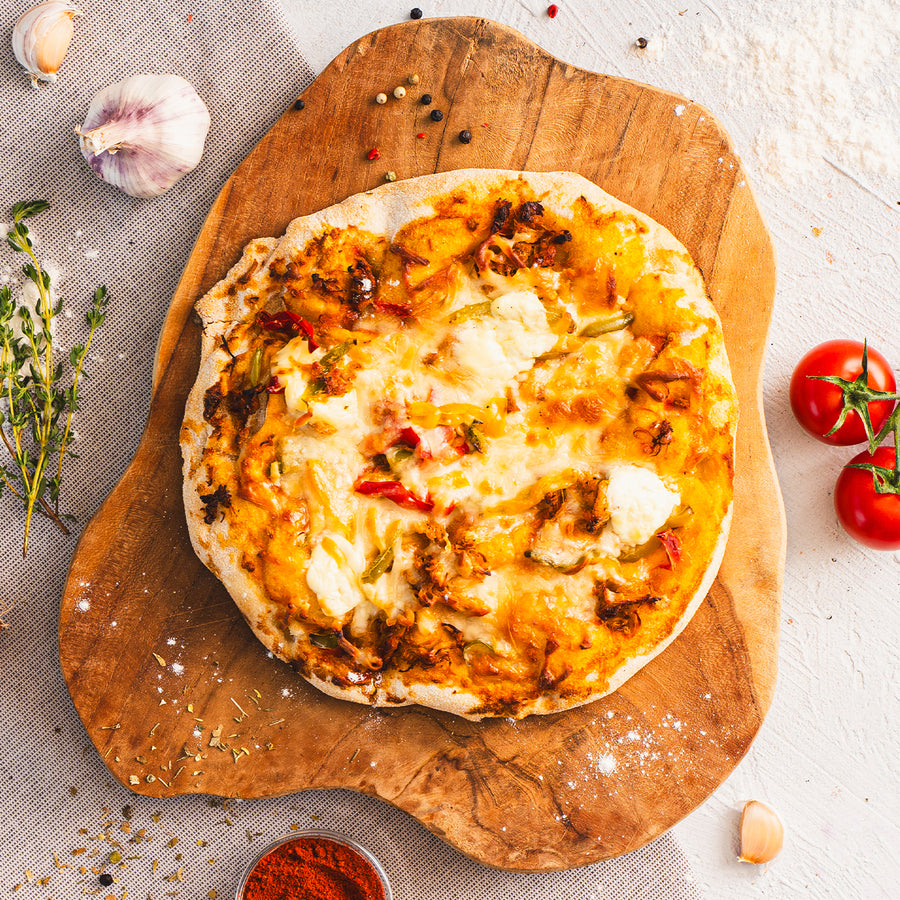 SportMeals High Protein Pinsa with pulled chicken, on a wooden board